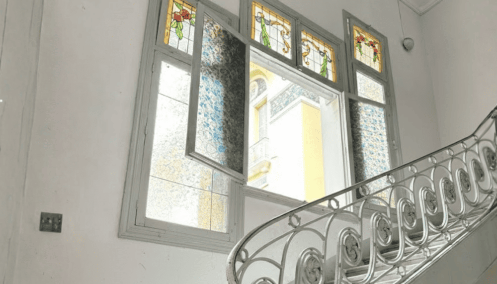 The stained-glass windows add a touch of brilliance to the space, especially during the day when sunlight streams through